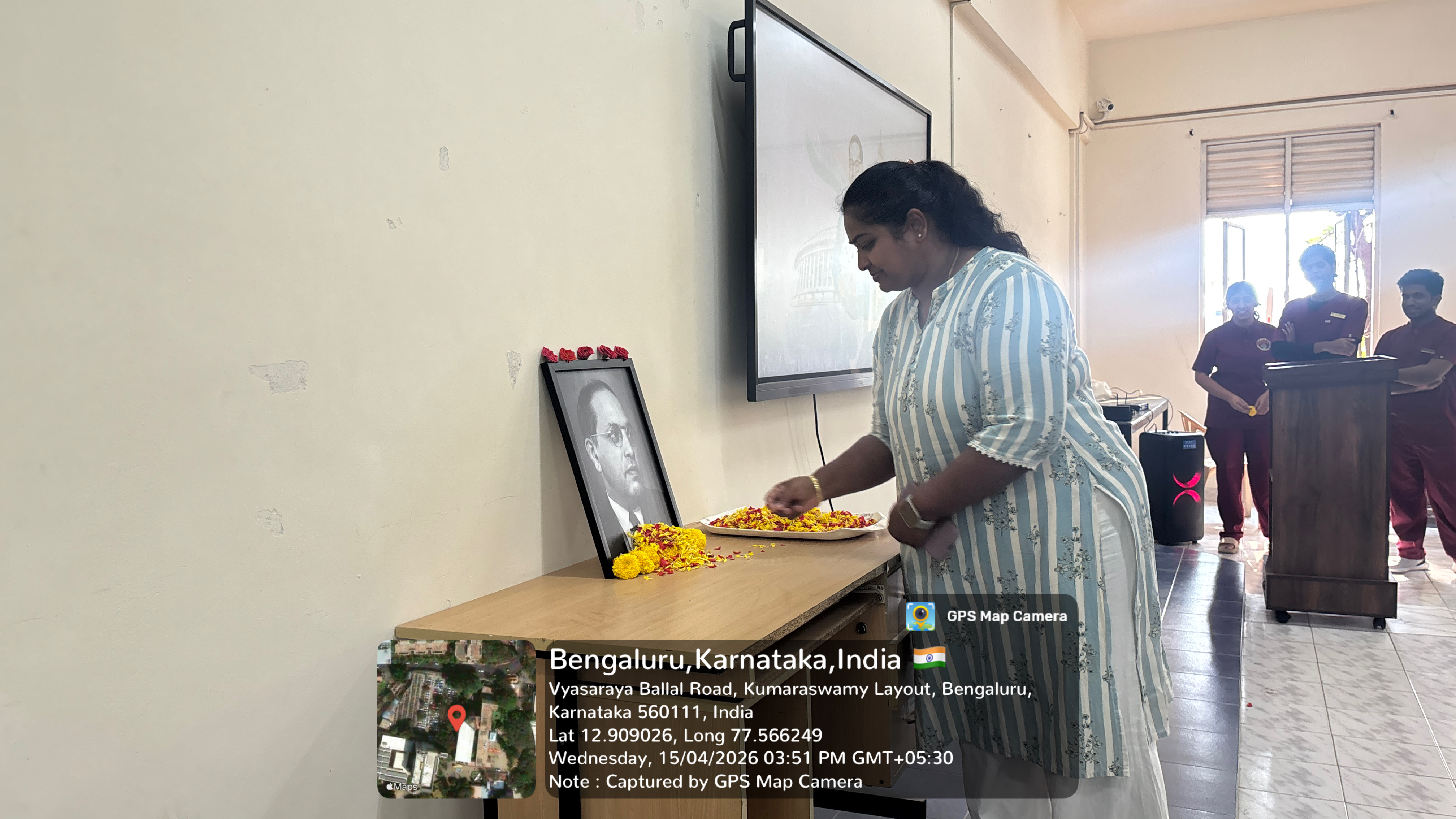 Faculty members offering floral tributes to Dr. B.R. Ambedkar portrait