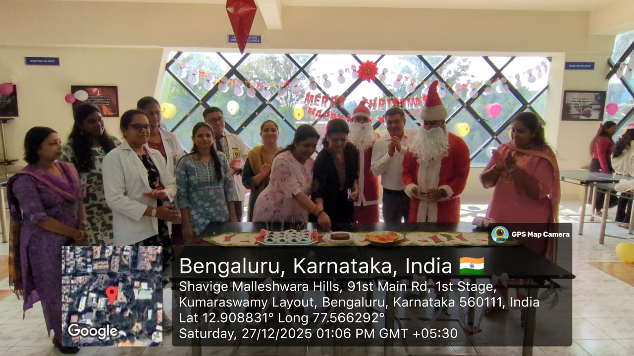 Faculty members cutting a traditional plum cake