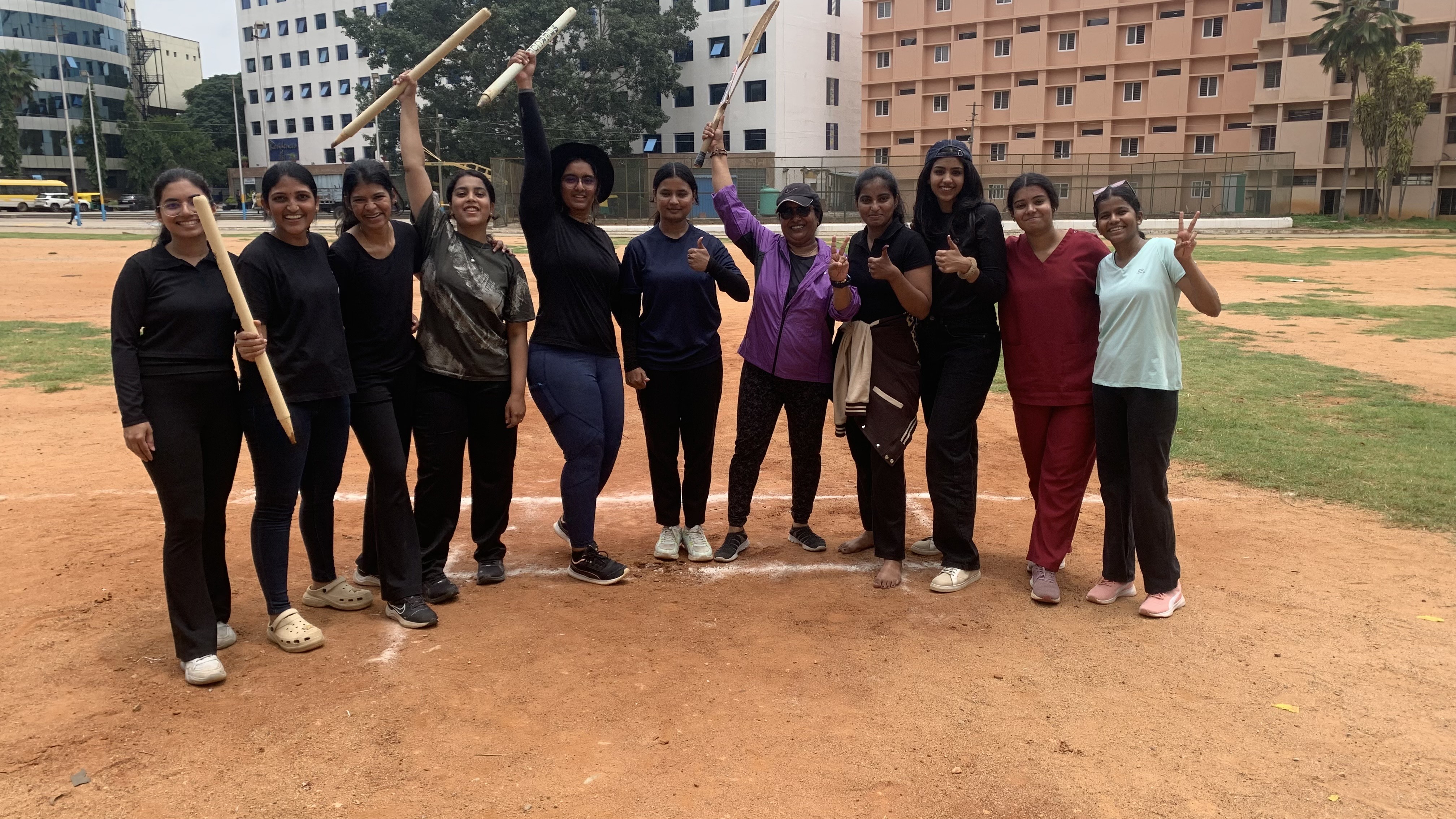 Women's cricket team in white uniforms