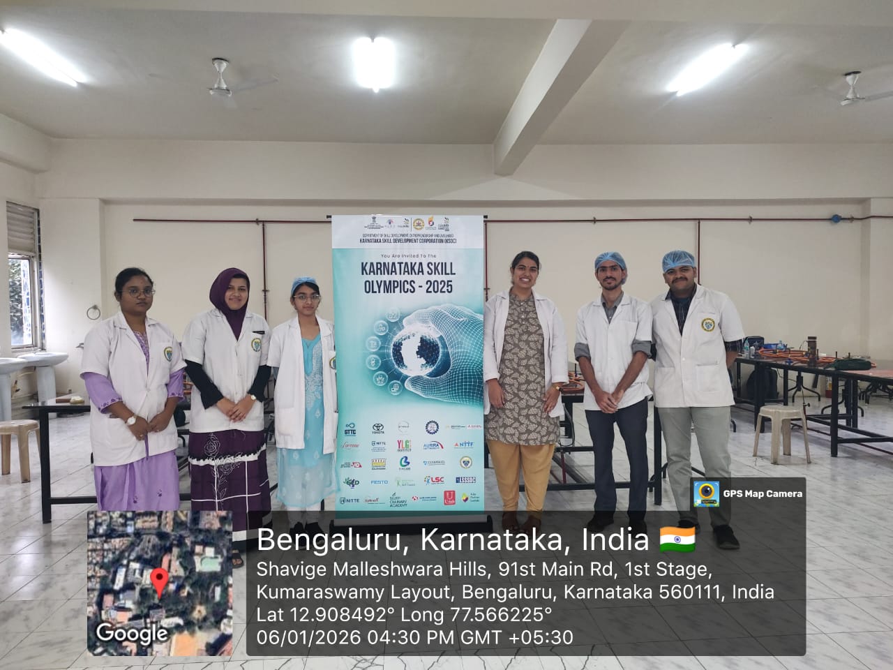 A faculty member demonstrating a dental prosthetics technique to a student during the competition