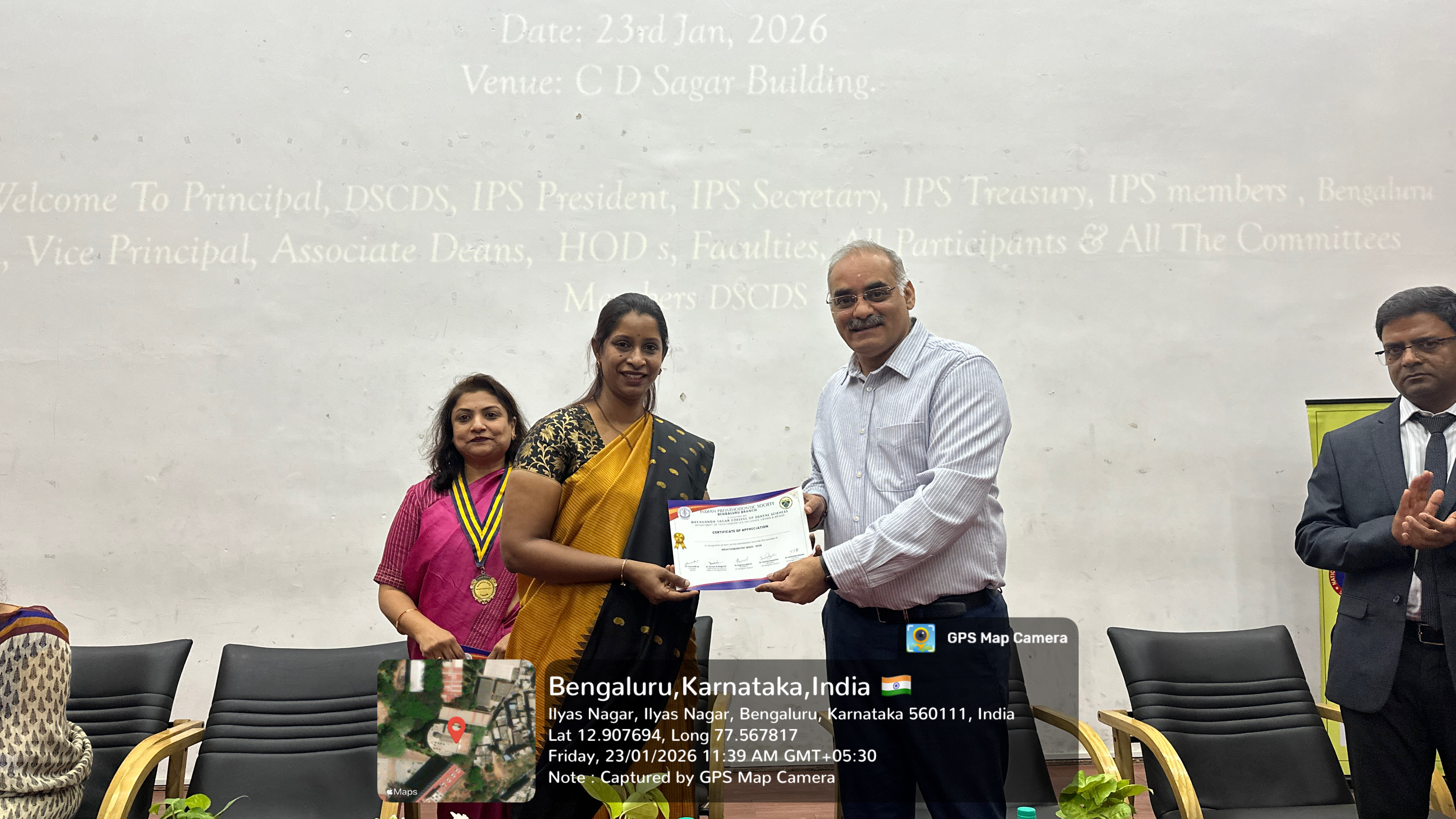 Faculty member receiving a certificate