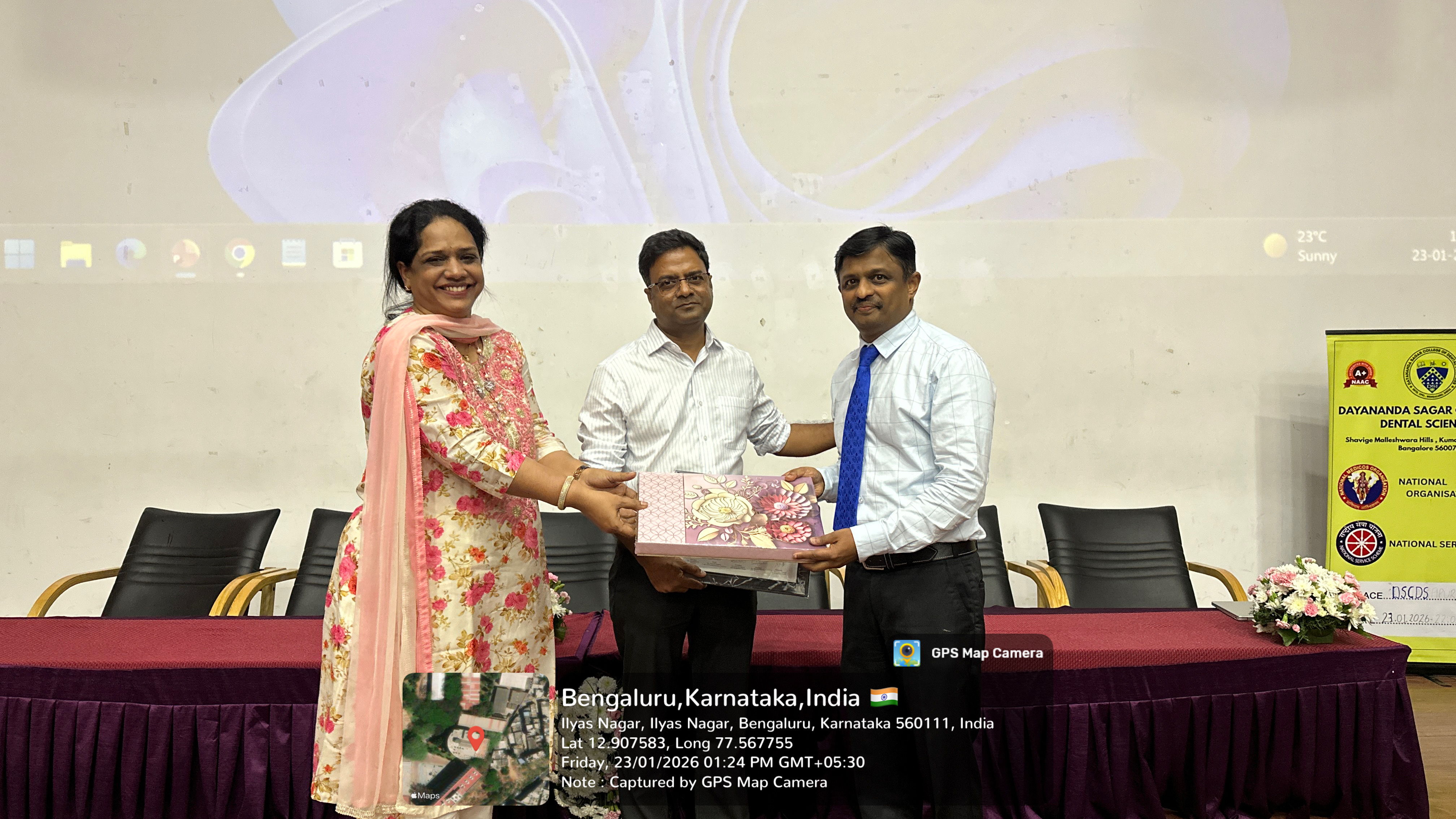 Dignitary presenting a certificate to a participant