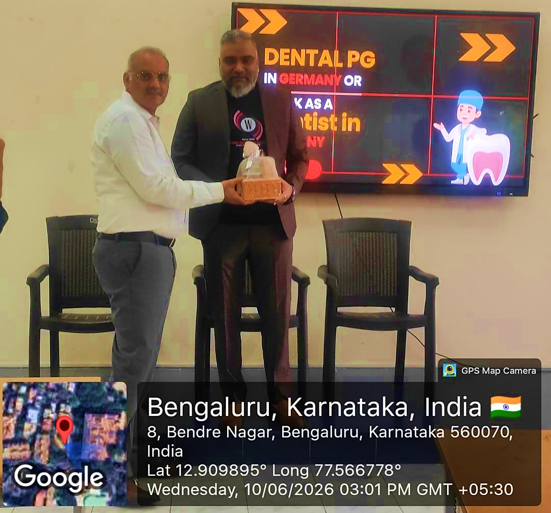 Dr. Naresh Bhati receiving a memento from a dignitary