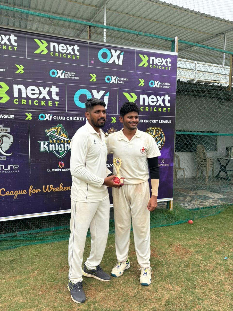 Players receiving a trophy from an official