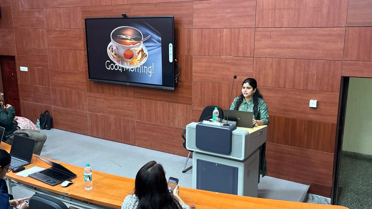 Speaker addressing delegates at the podium during basic lectures